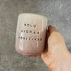 Pale pink mug with saying in Spanish