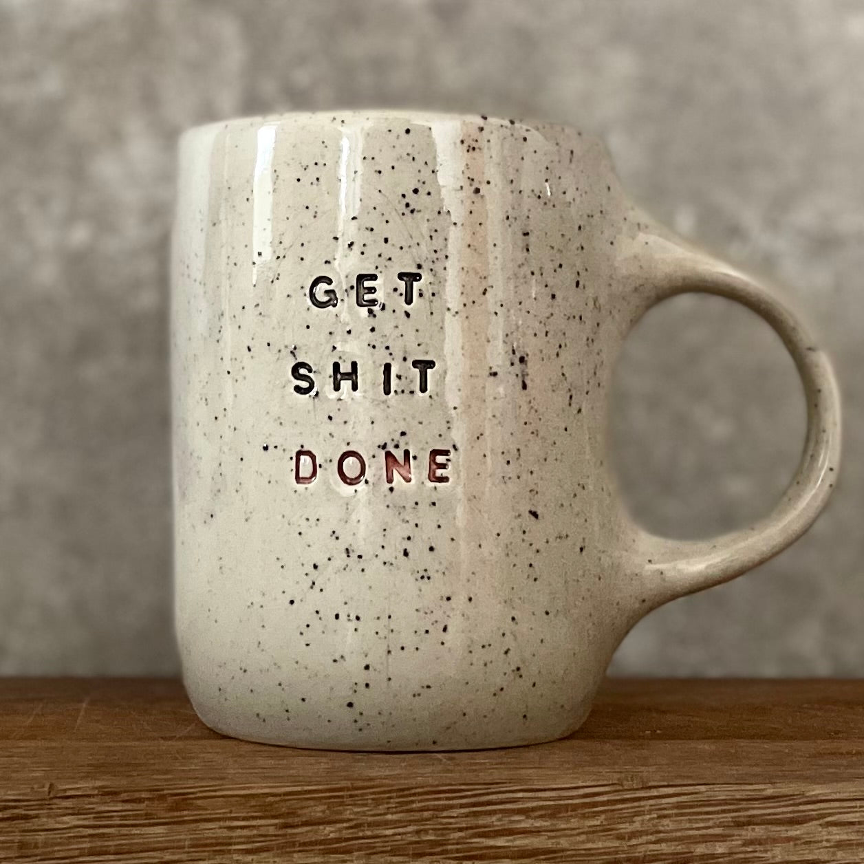 Cool ceramic mug with text GET SHIT DONE
