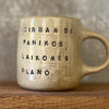 Ceramic mug with words about work