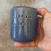 Mėlynas puodelis "LIEKAM LOVOJ" 150 ml