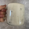 Ceramic mug with saying about magic
