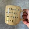 Yellow mug with words about work