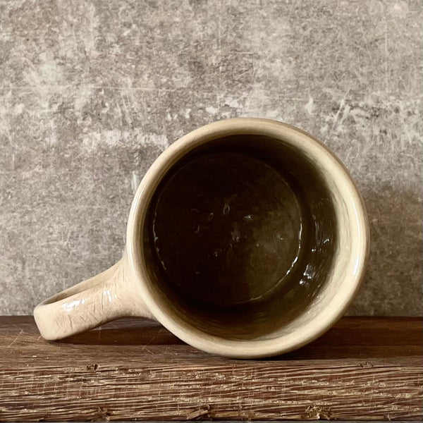 Brownish mug with funny saying