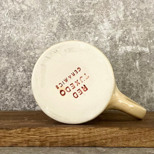 Gelsvas linksmas puodelis