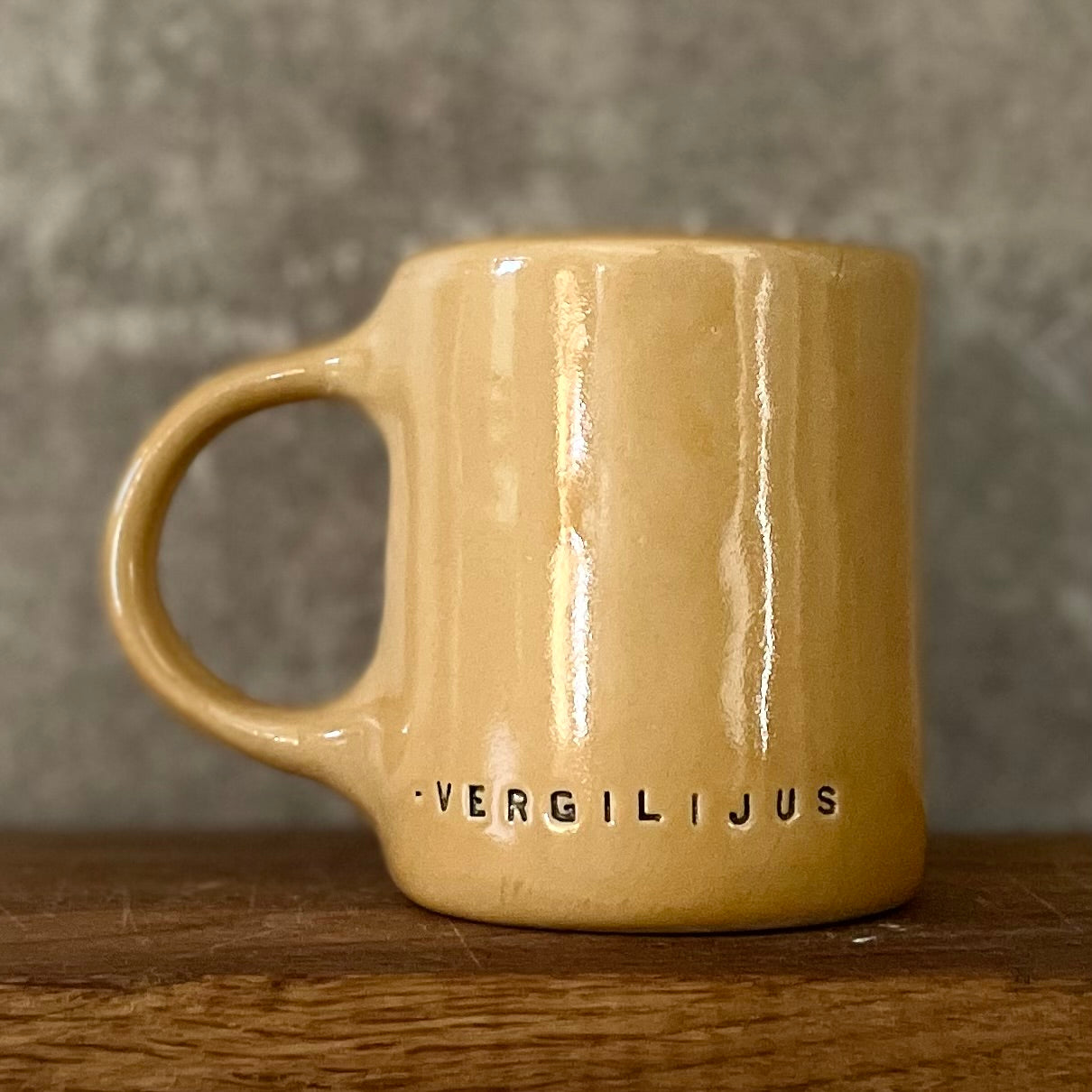 Yellow ceramic mug with quote by Vergil