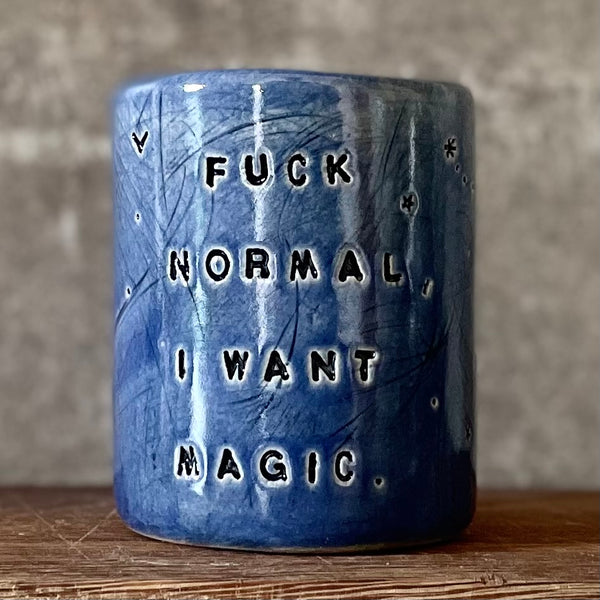 Deep blue mug with magic saying
