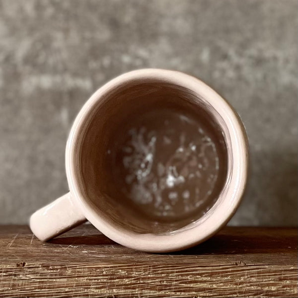 Pale pink mug with prosecco saying