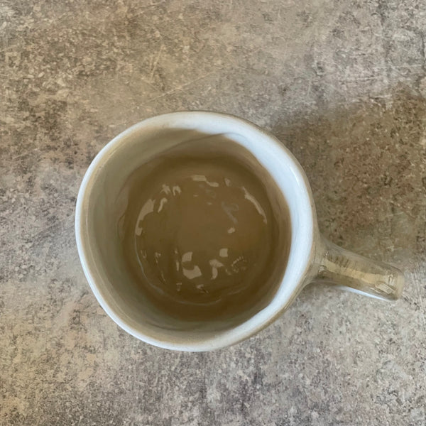 Ceramic mug with artist quote