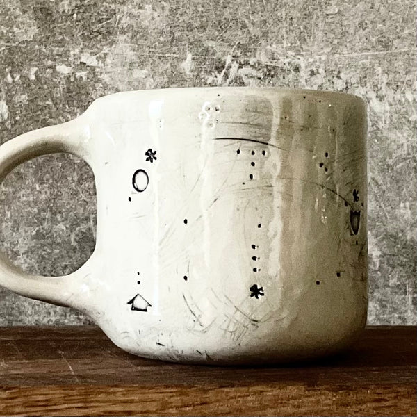 Ceramic mug with saying about magic