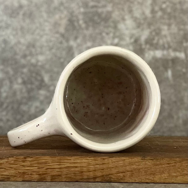 Pale pink ceramic mug with word LĖTAI