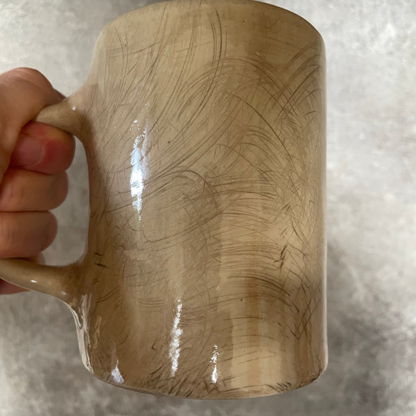 Brownish mug with funny saying