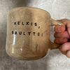 Big beige mug with saying in Lithuanian