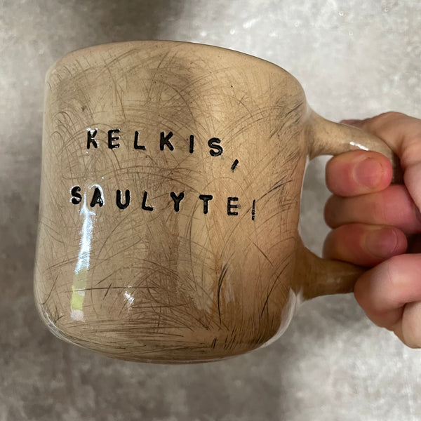Big beige mug with saying in Lithuanian