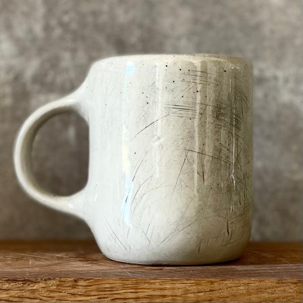 Speckled mug with words about work - another
