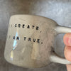 Ceramic mug with artist quote
