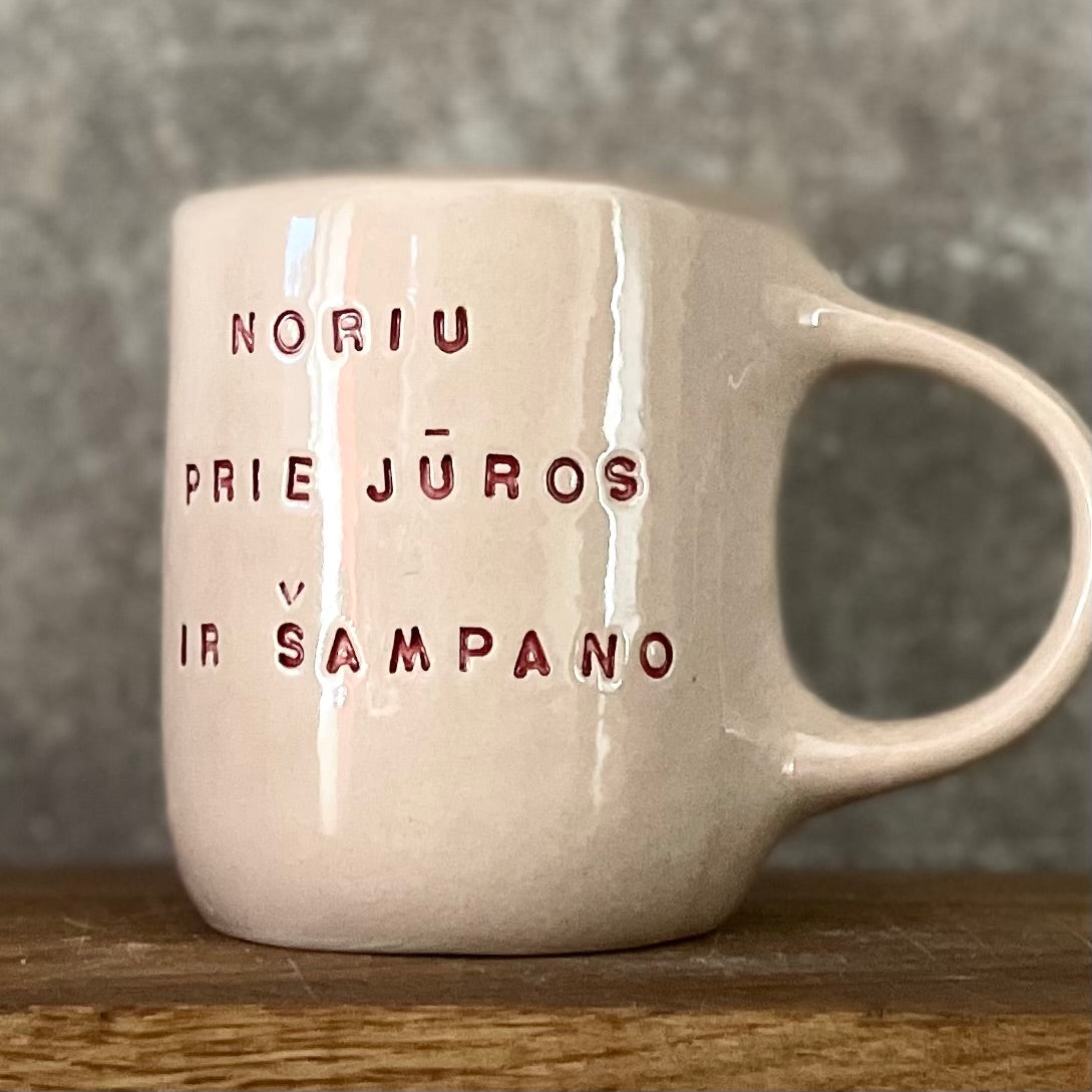 Pink big mug with saying in Lithuanian