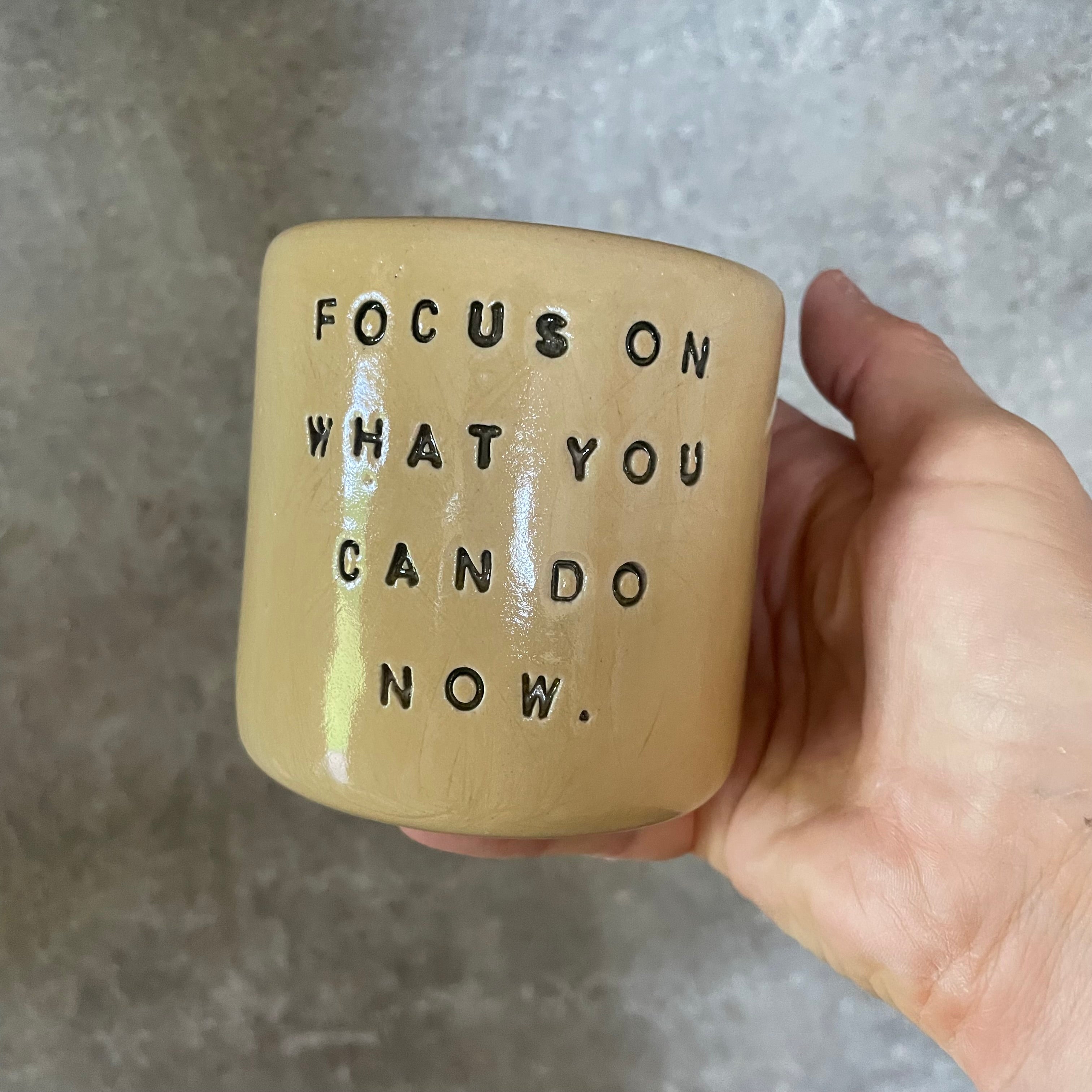Bright yellow tumbler for motivation