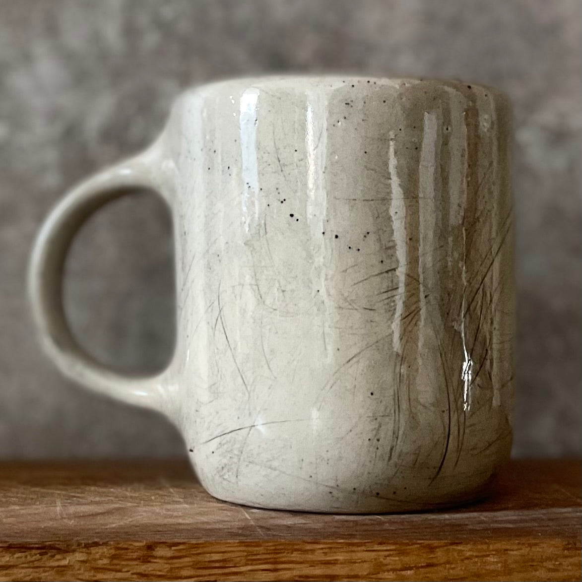 Speckled mug with words about work - another
