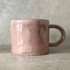pink ceramic mug with saying